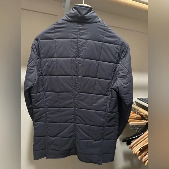 Brunello Cucinelli men’s quilted navy jacket.
